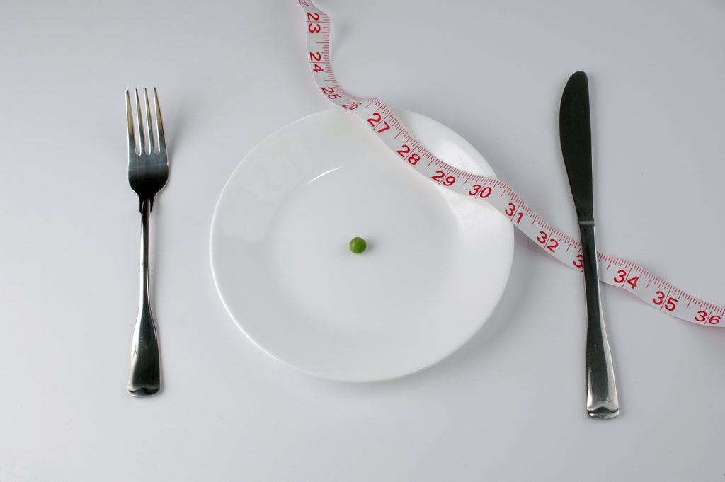 Extreme diet with pea and tape measure