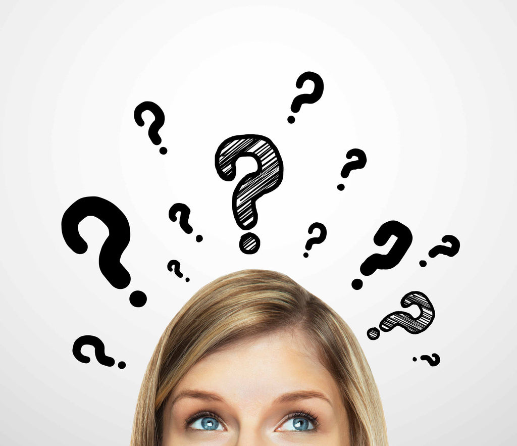 woman thinking with question marks above her head